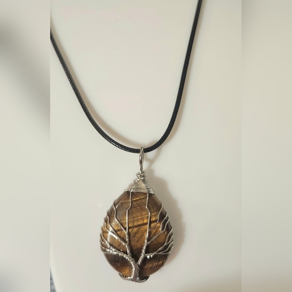 A tree pendant I made with a tiger Tree of Life pendant with a tiger\'s eye gemstone.
